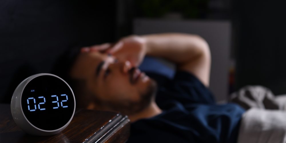 Depressed,Young,Asian,Man,Lying,In,Bed,Cannot,Sleep,From